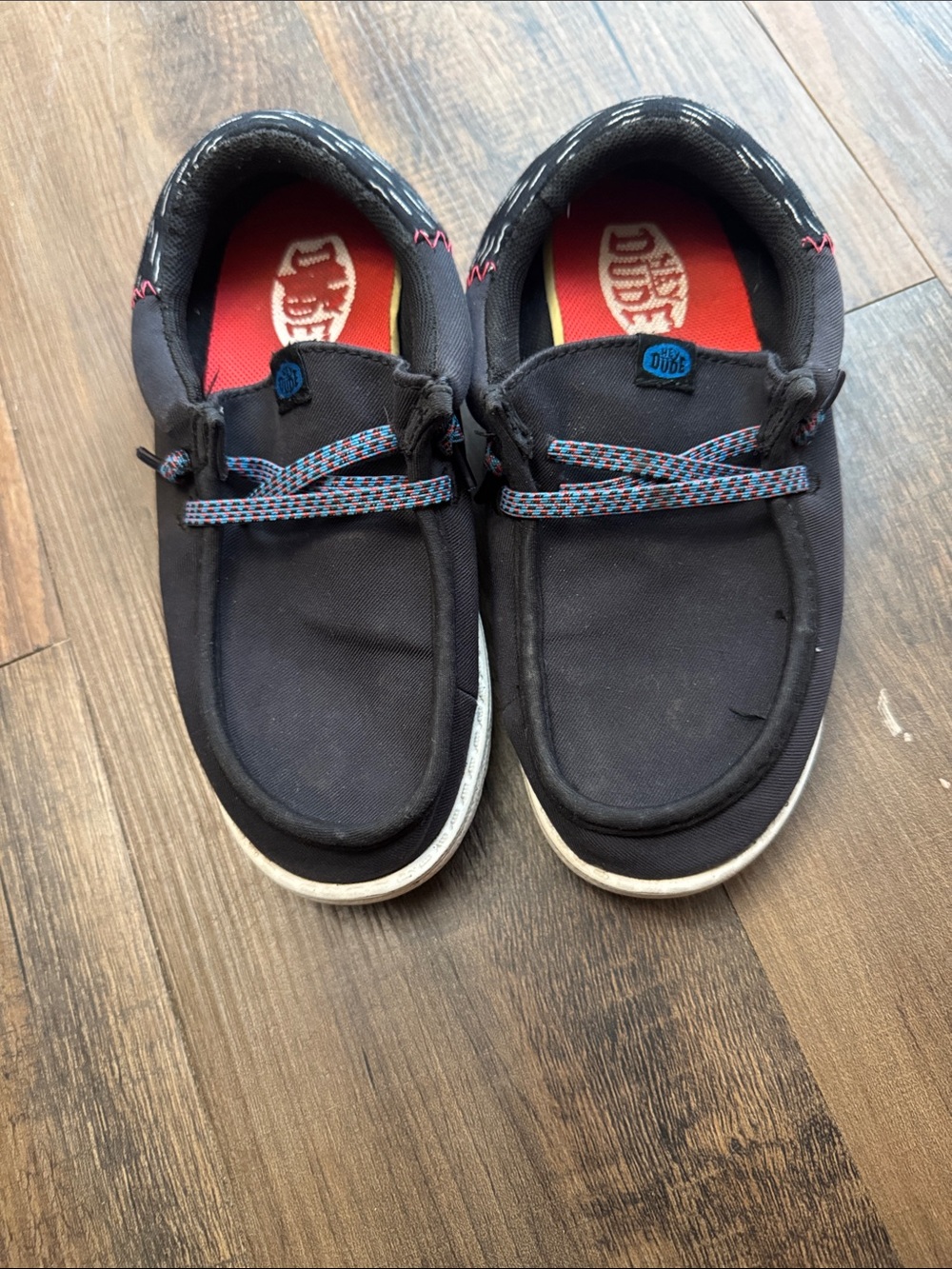 Hey Dude Kids Black Canvas Slip-Ons with Blue and Red Accents